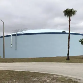 Water tank palm trees sky