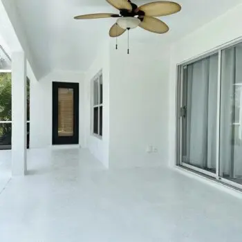 Painted patio with ceiling fan